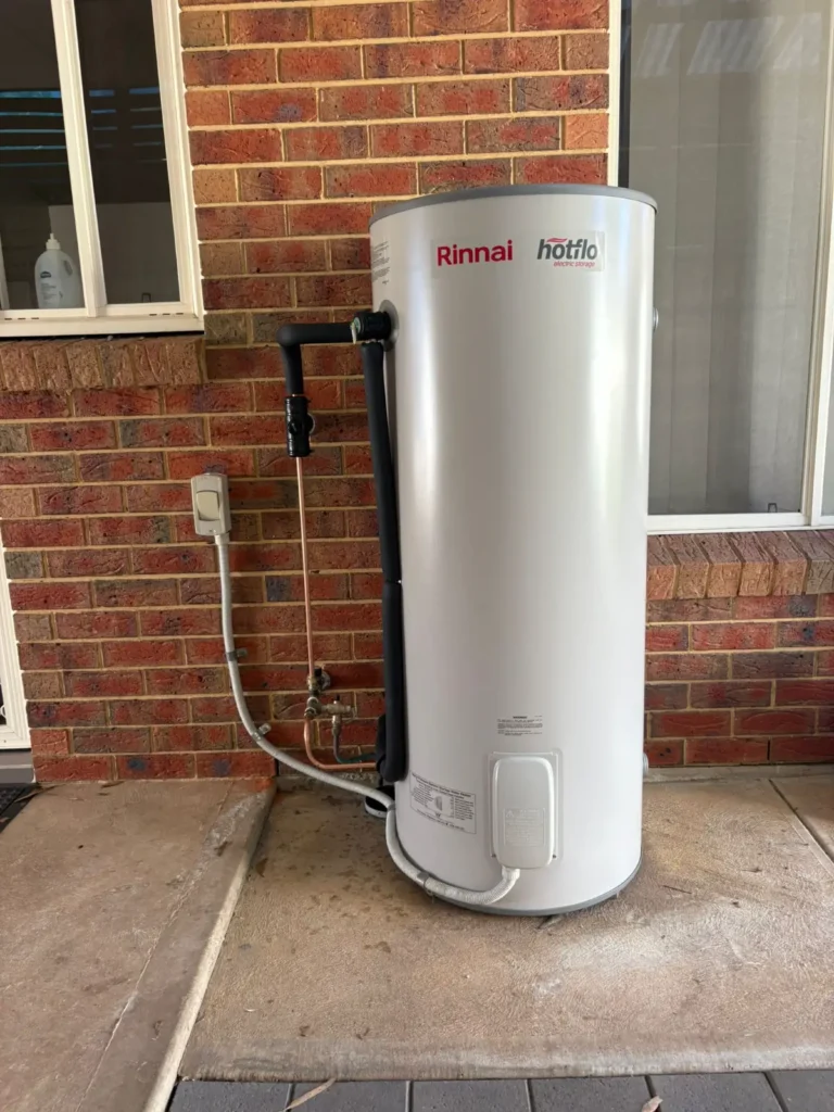 Certified hot water plumber Adelaide from Citywide Plumbing & Gas Fitting Solutions completing a high-quality electric storage tank installation with precision pipework.