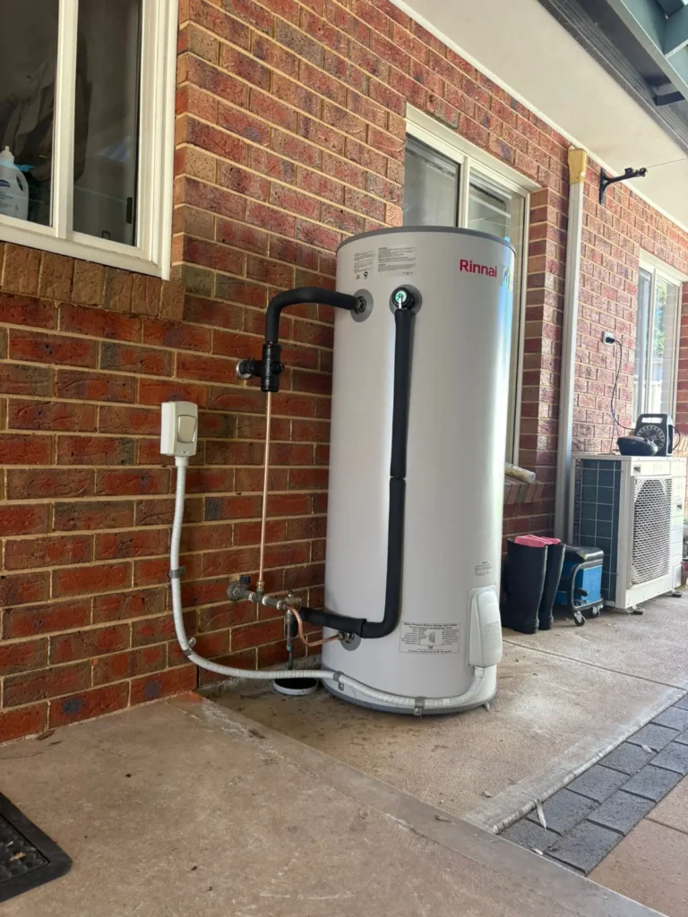 Professional hot water replacement Adelaide: A brand new Rinnai Hotflo electric storage unit successfully installed to replace an old, leaking system.